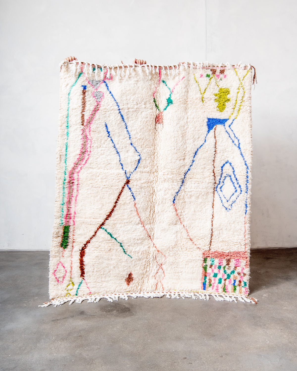 Modern, designer, handcrafted Berber rug from Morocco. Beniourain carpet with beautiful colours and patterns and fluffy wool texture.